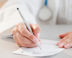 Female doctor's hands writing prescription (Medical Inquiries)
